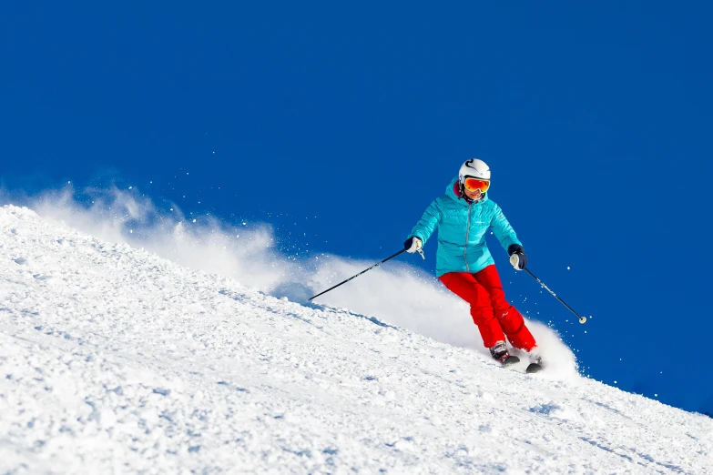 the skier is coming down the mountain covered in snow