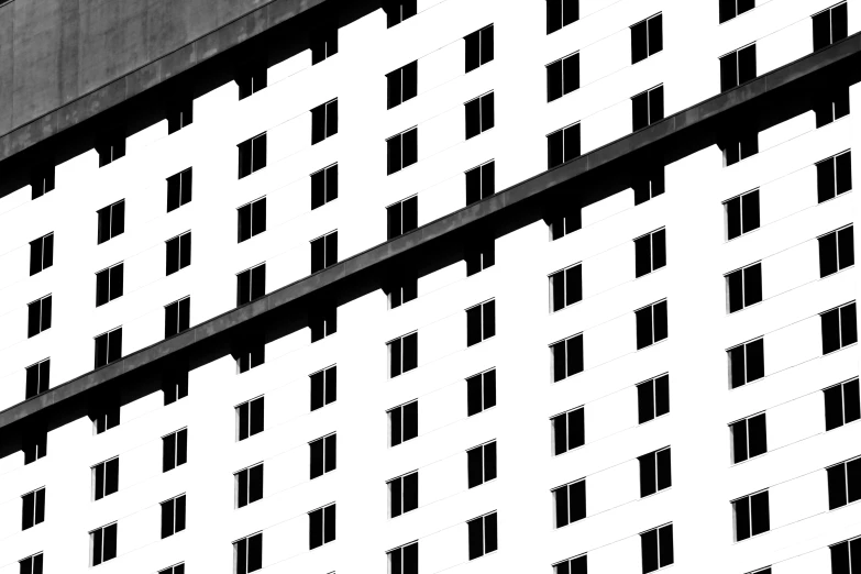 black and white pograph of a building with multiple windows