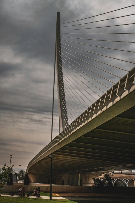 a large bridge sitting on top of a lush green field