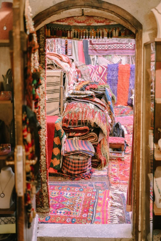 a room is seen through a mirror with many items on it