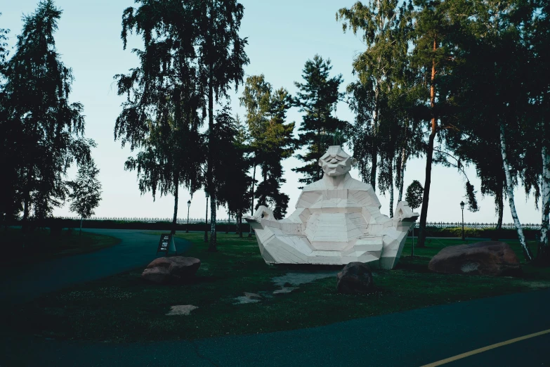 a park area with a statue that is in the middle