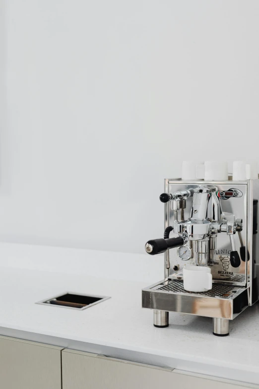 a coffee maker that is on top of a table