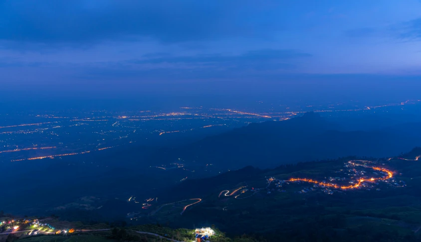 a city skyline from above at night time