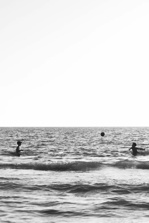 some people in the water with their surf boards