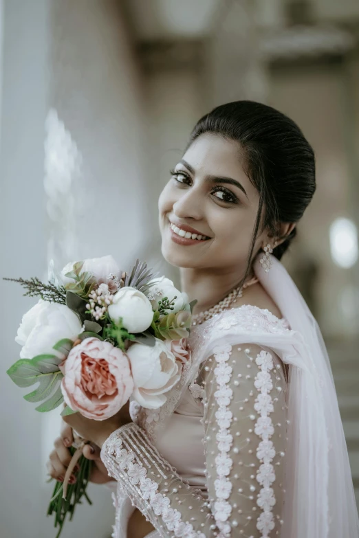 a woman in a dress holding a bouquet