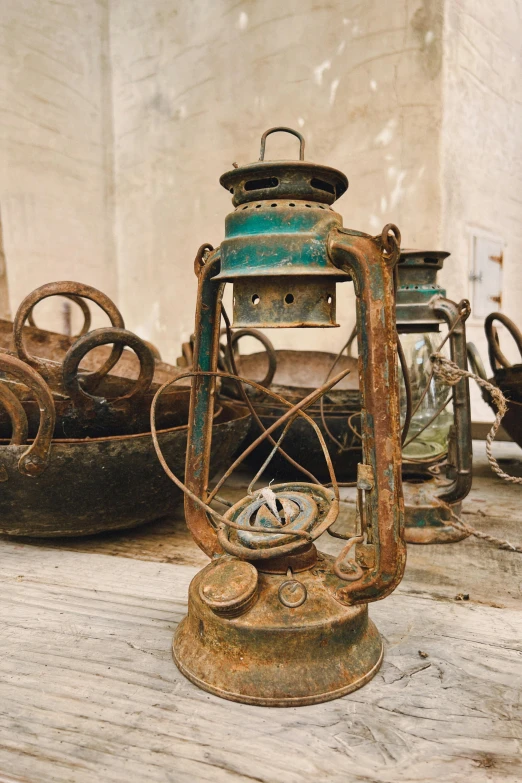 a rusty light fixture is in front of some rusty junk