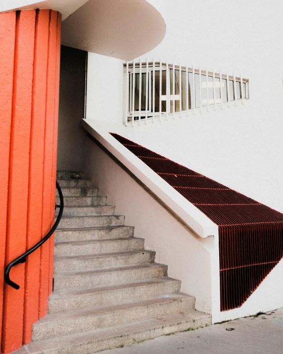 the stairs lead up to the front door of an old house