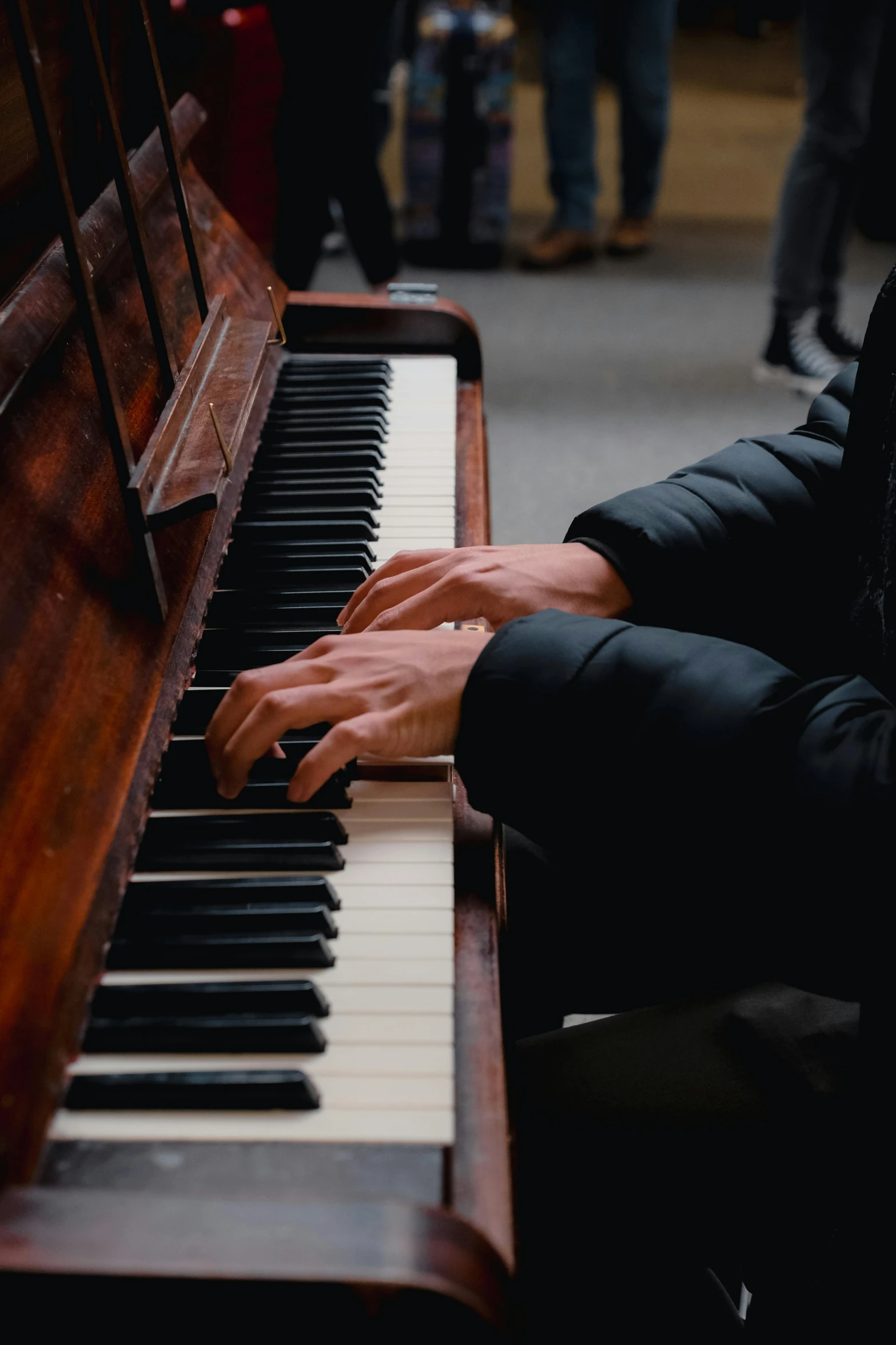 a close up of someone playing piano with hands