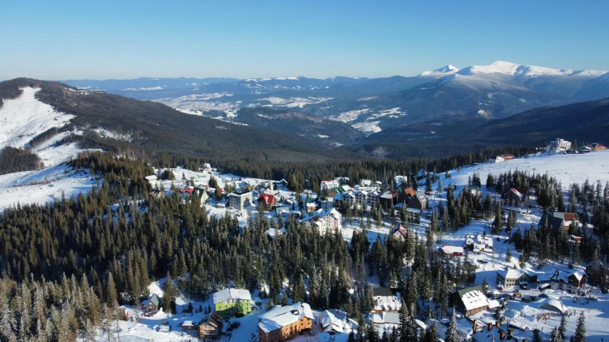 there is a very long ski slope that runs between the town and the mountains