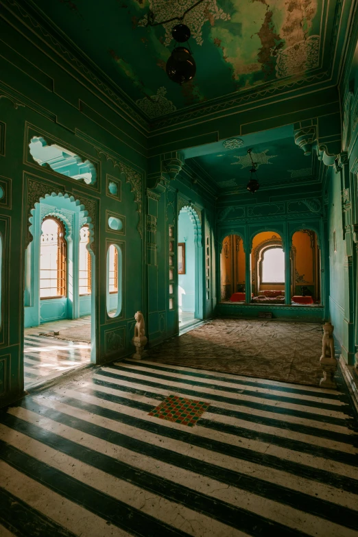 the interior of an old palace with lots of windows