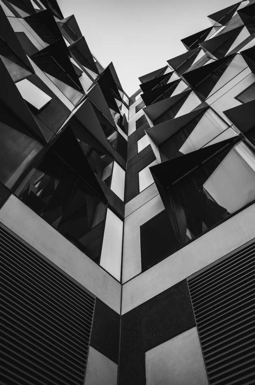 the top of some tall buildings with glass coverings