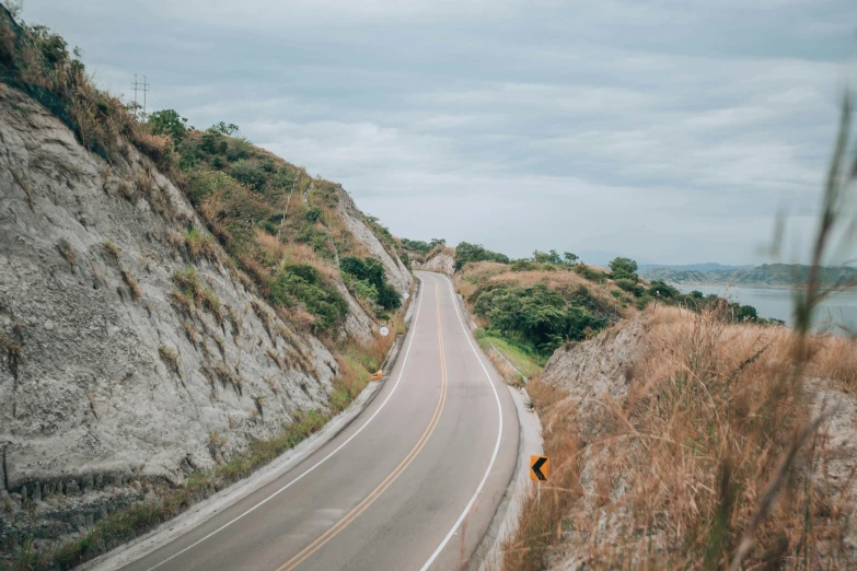 a truck is traveling down a hill side