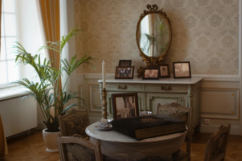 an elegant dining table has chairs around it