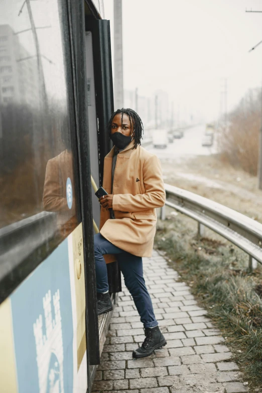 a woman with a beard leans out of a train