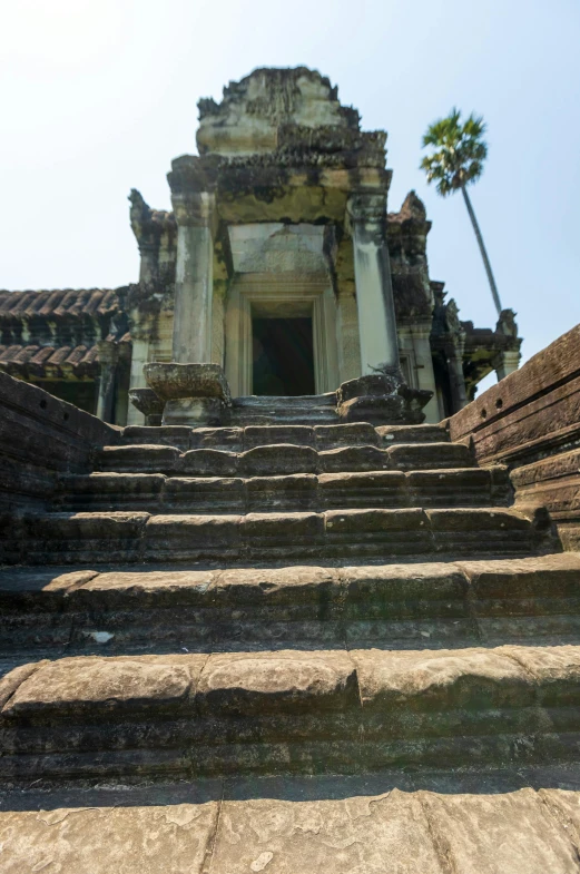 a stone staircase leads up to a doorway