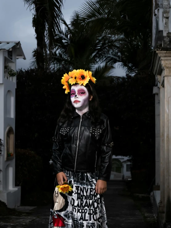 a lady with painted face and flowers in her hair