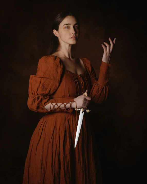 a woman in red is holding a knife