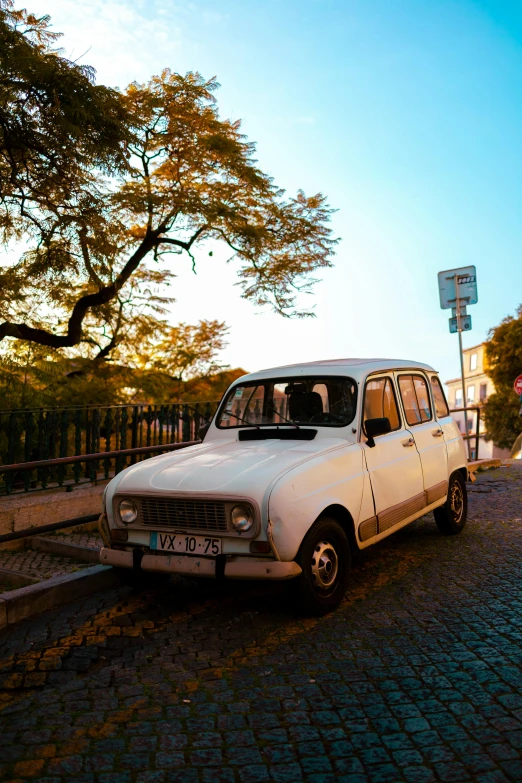 white car parked in front of a street light