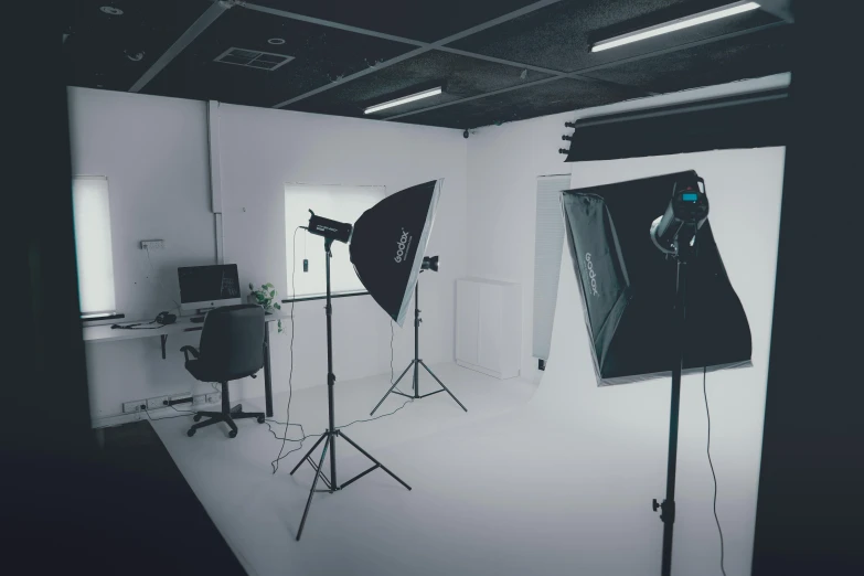 two pography equipment and a camera in a room