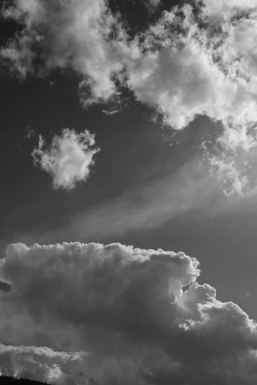 a black and white pograph of clouds