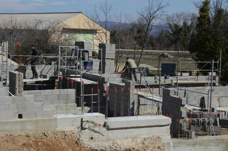 a picture of a building site with construction workers