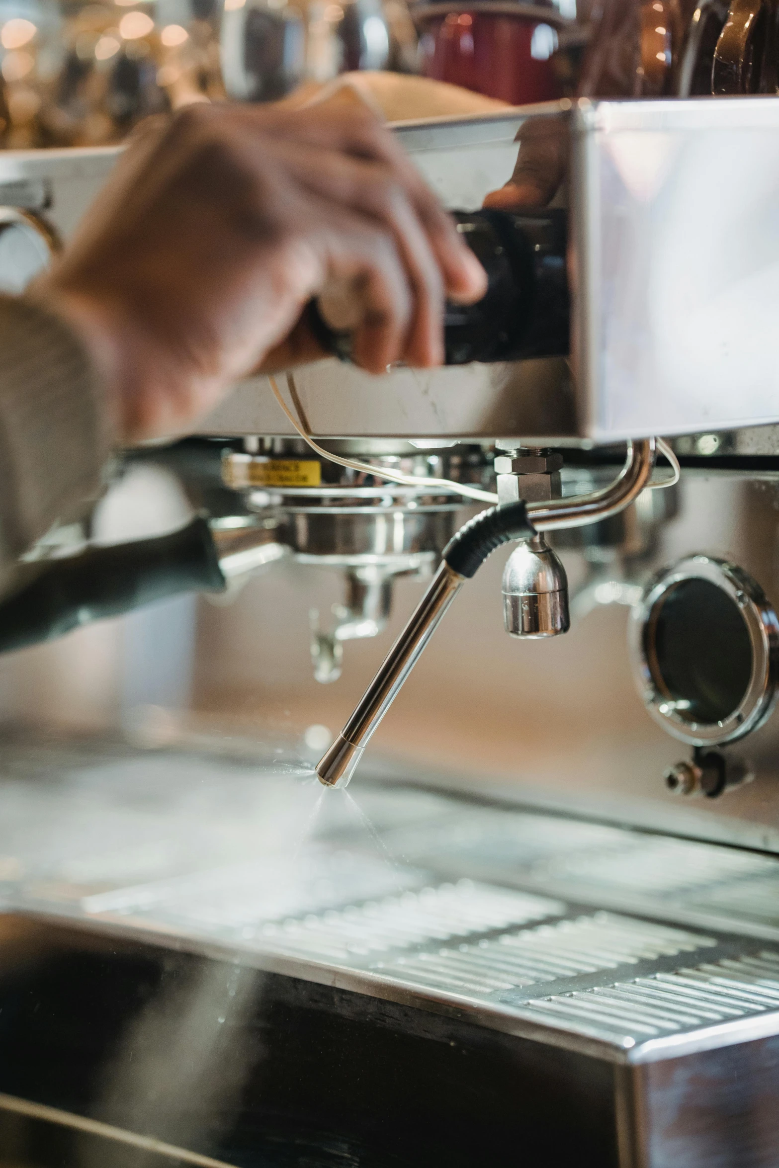 man is pressing the number on a coffee machine