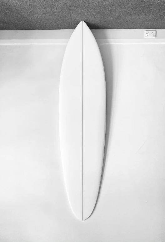 a surf board leaning up against the wall