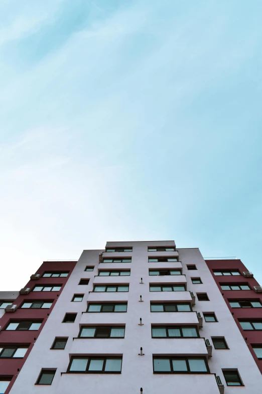 the large building has two balconies on the second floor