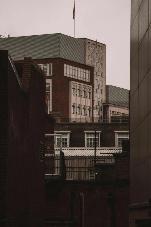 a large building with tall windows and two balconies