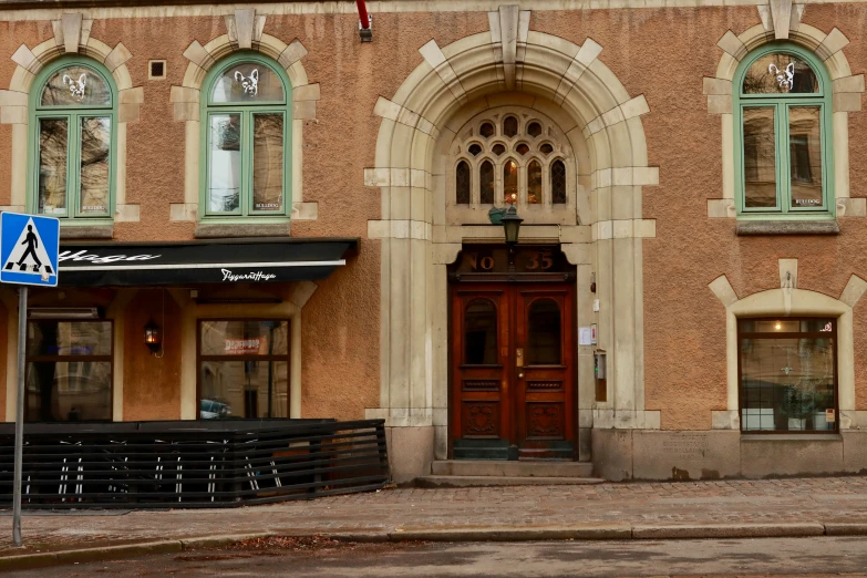 an old building with a sign sitting on the side