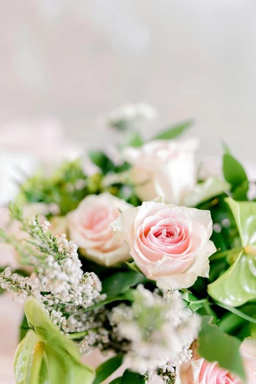 the flowers are white and pink in the bouquet