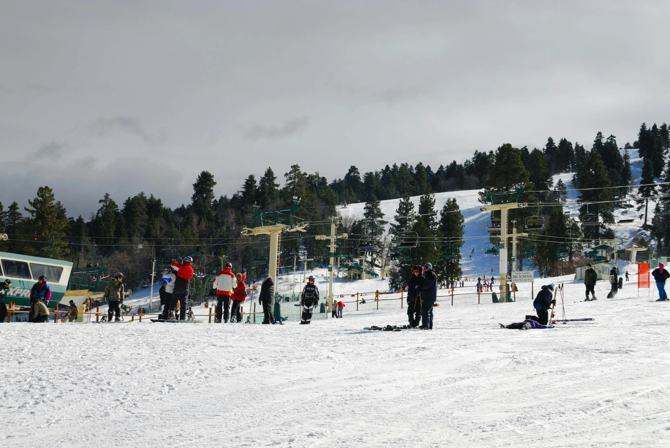 a ski resort with skiers and snowboarders