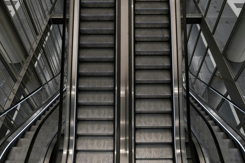 an escalator at an airport with no people in it