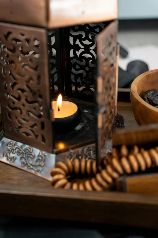 the candle is sitting on a table near some food