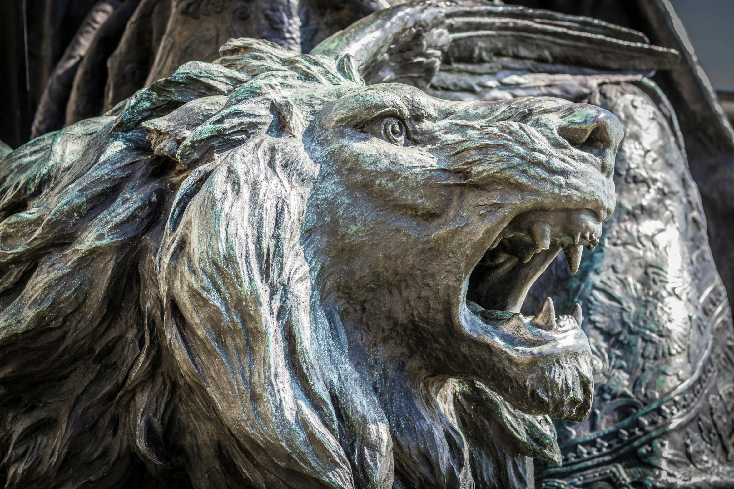 a metal statue of a lion is shown