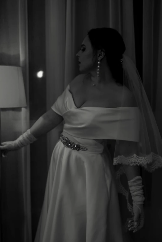 black and white pograph of woman in wedding dress