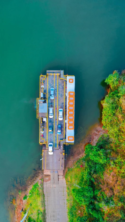 two cargo ships next to the side of a lake