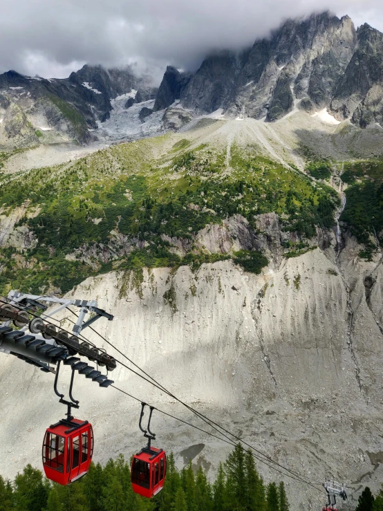 the train goes up and down the mountain and below it are other types of skis