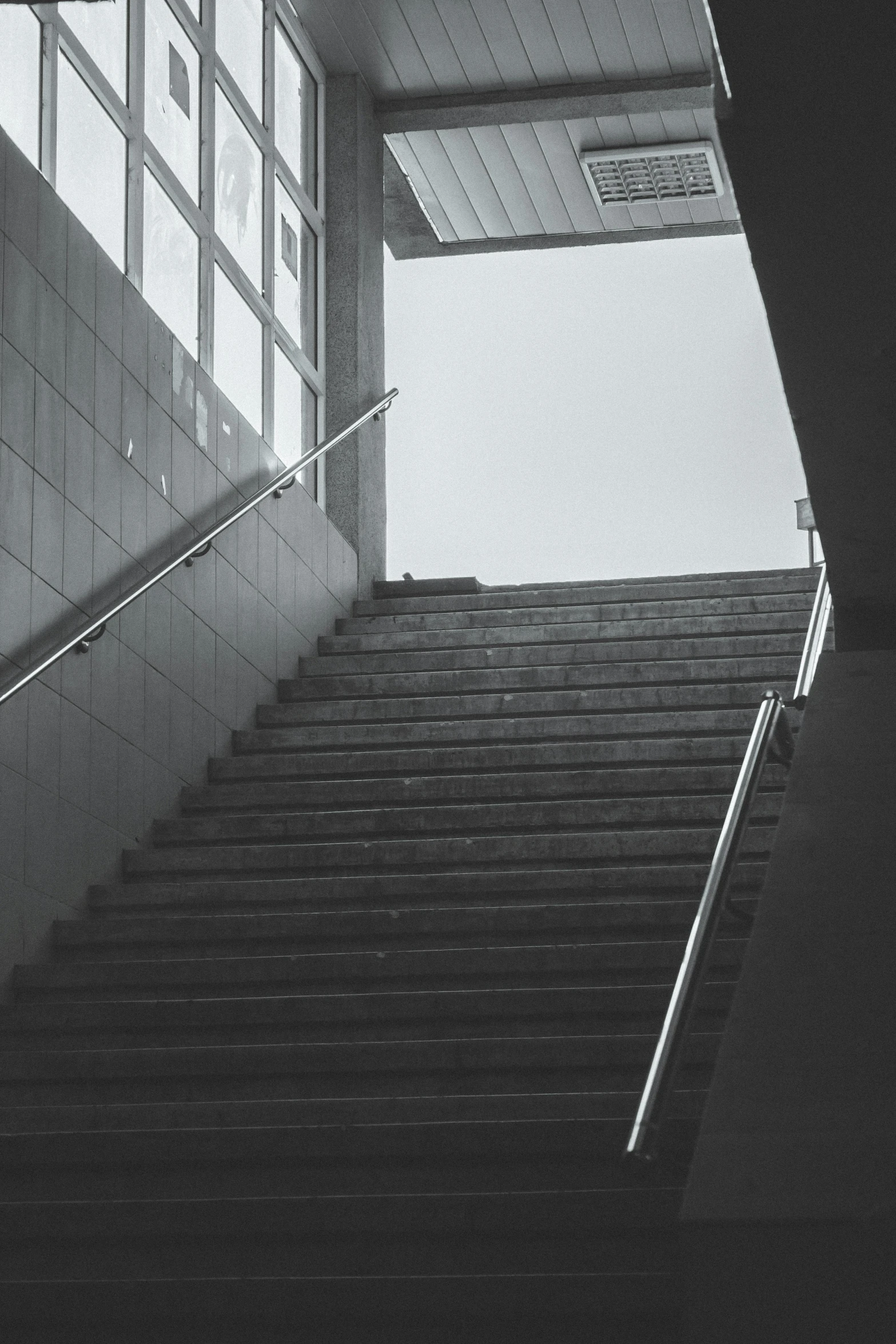 stairs leading to an area with some windows