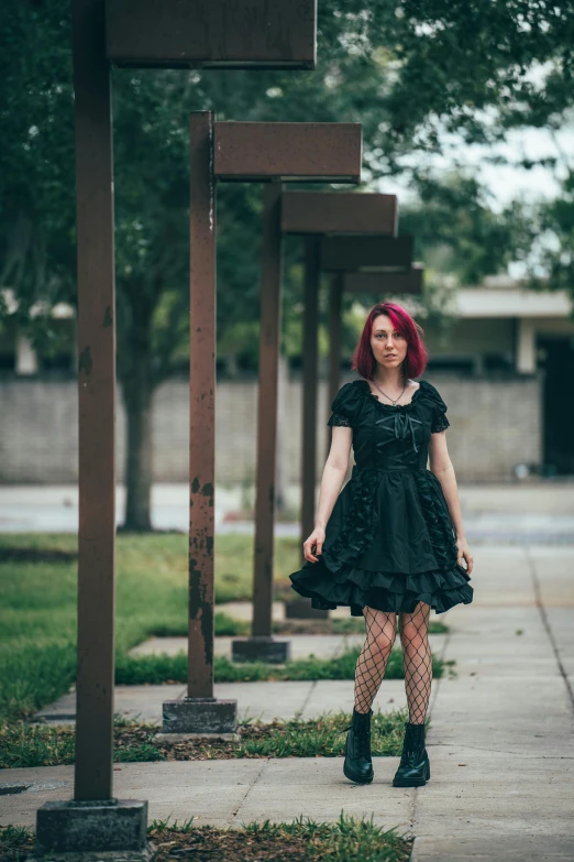 the woman is dressed in her black gothic - era dress