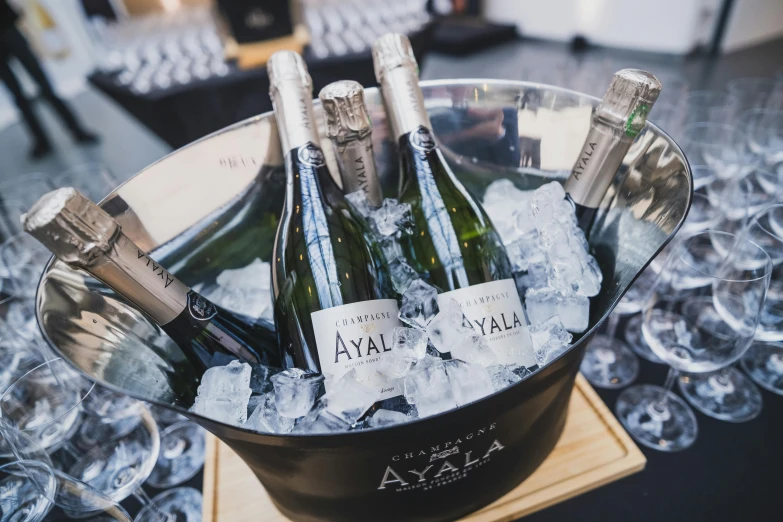 several bottles of champagne in an ice bucket