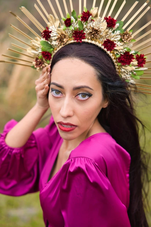 a woman with flowered hair comb wearing a red blouse