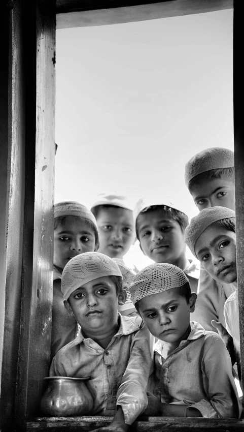 black and white image of a group of children outside