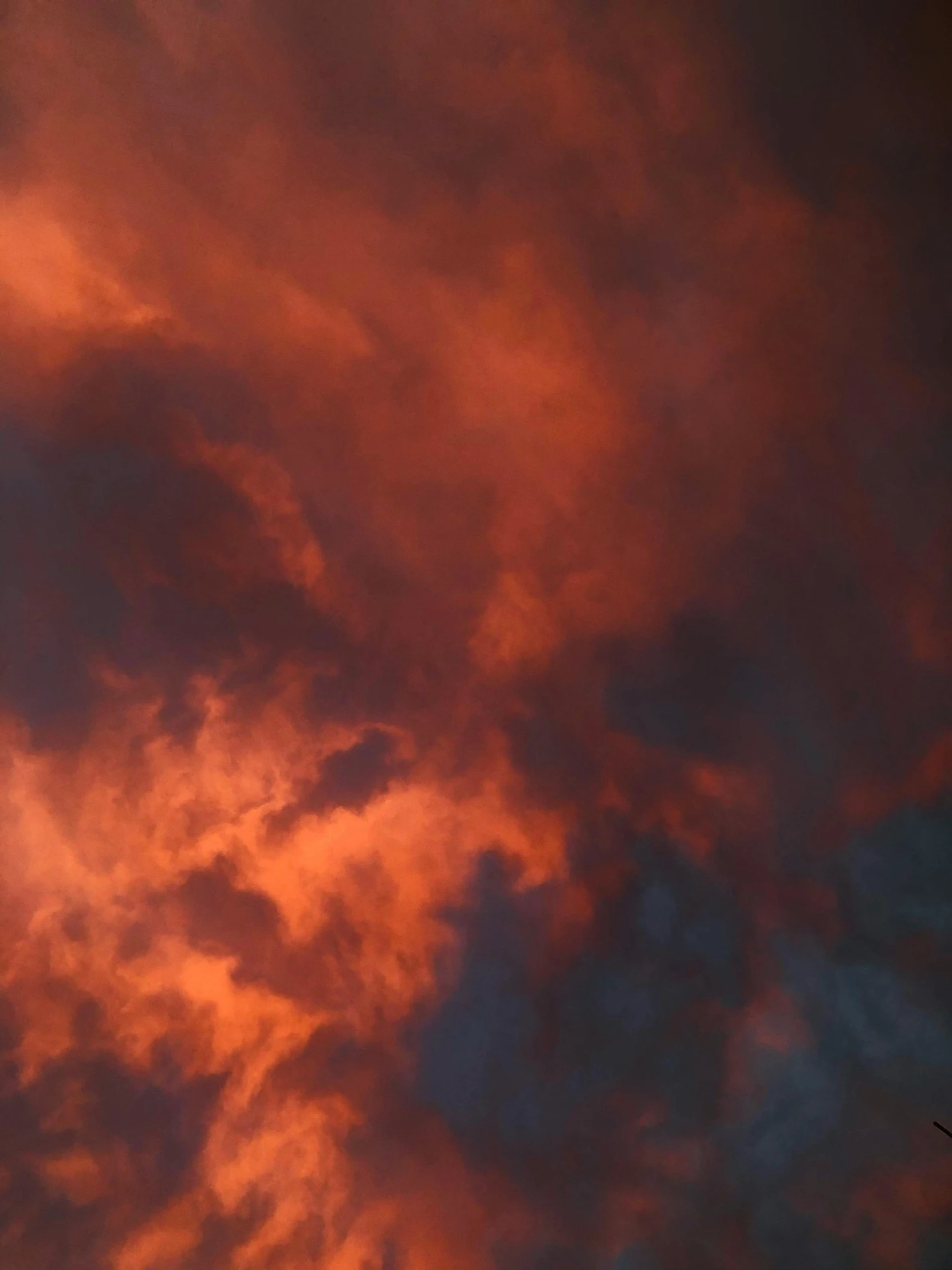 clouds with an airplane flying in the sky