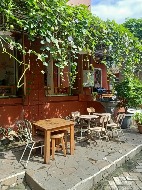 an outdoor patio area with various tables and chairs