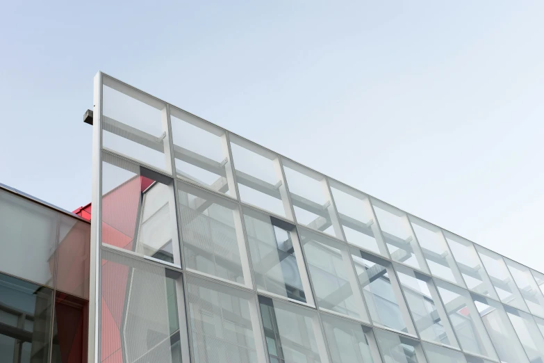 a building with multiple windows under a blue sky