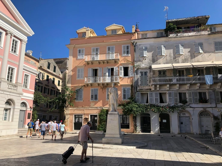 a city area with people standing and looking