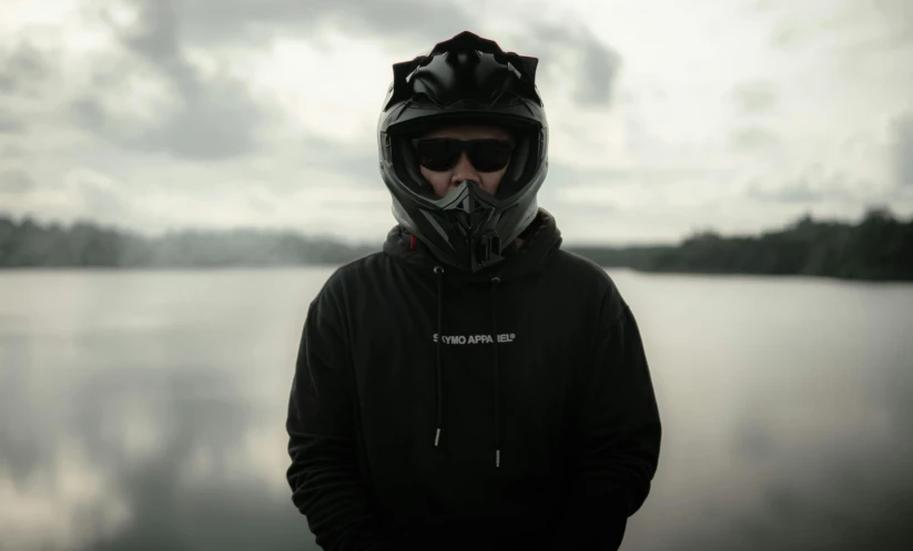 a person wearing a hoodie with a helmet and goggles