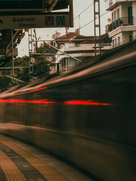 the subway passes by with its red line behind