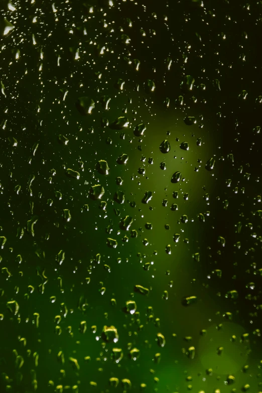 a window with drops of water on the outside